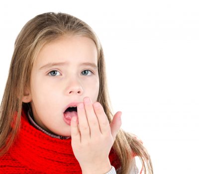 48705726 - sick little girl in red scarf coughing isolated on a white background